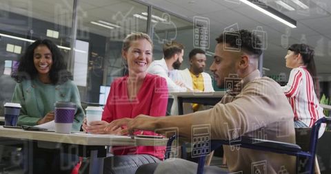 Diverse Professionals Collaborating Energetically in Modern Office