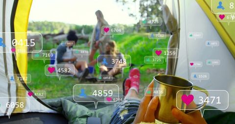 Relaxing camper holding metal mug in tent with social media overlays and friends outdoors