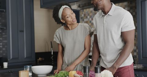 Couple Preparing Healthy Meal Together in Kitchen
