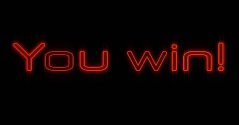 Winning neon sign in glowing orange on black background