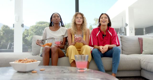 Diverse Group of Friends Relaxing on Couch Watching TV - Download Free Stock Images Pikwizard.com