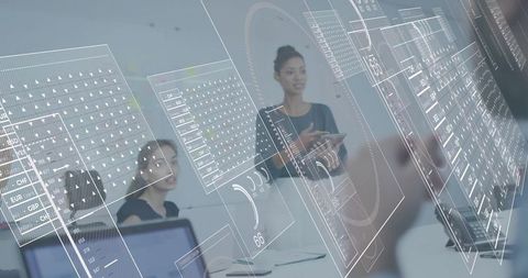 Business leader presenting digital data visuals to team in modern tech boardroom