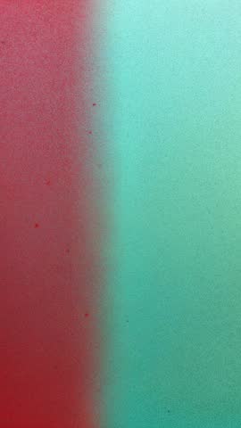 Vertical video showing soft gradient split warm red to cool teal minimalist abstract loop