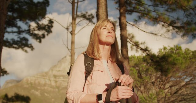 Woman Enjoying a Peaceful Hike in Mountainous Forest - Download Free Stock Images Pikwizard.com