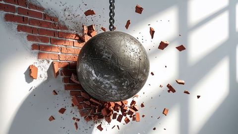 Dynamic wrecking ball demolishing brick wall in sunlit room