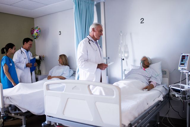 Doctor Interacting with Senior Patient in Hospital Ward - Download Free Stock Photos Pikwizard.com