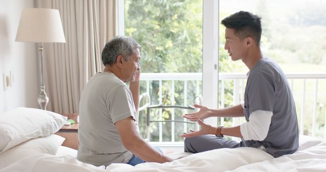 Young Caregiver Assisting Elderly Man at Home - Download Free Stock Images Pikwizard.com
