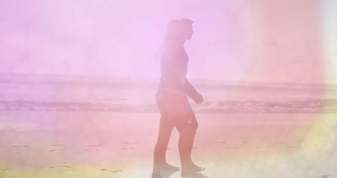 Solo Traveler Walking Along Tranquil Shore in Pastel Light