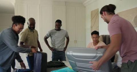 Friends Packing for Wedding Celebrating Exciting Travel Plans Together