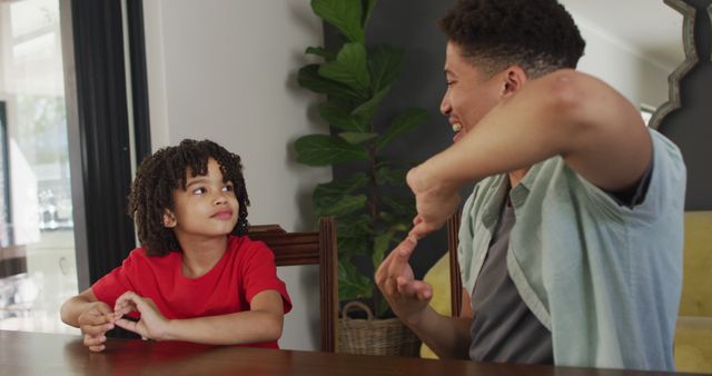 Father Bonding with Son While Sharing a Laugh at Home - Download Free Stock Images Pikwizard.com