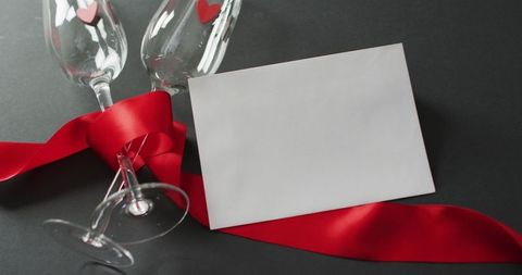 Valentine's day celebration scene with heart glasses and card