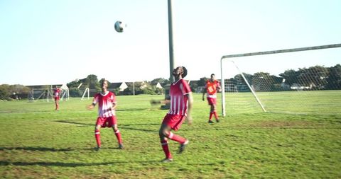Soccer Player Anticipating Ball on Game Day Field