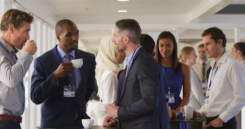 Diverse professionals networking at business event