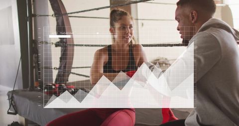 Athletic Couple with Data Overlay in Urban Gym