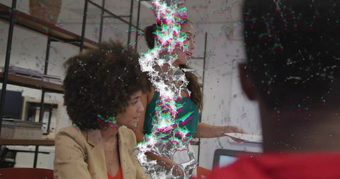 Team collaborating in modern office with vertical digital glitch during presentation