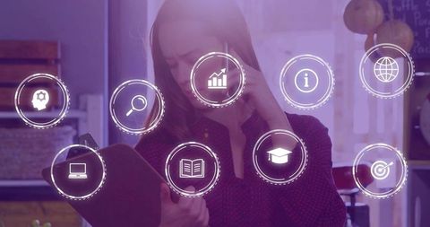 Woman studying tablet with augmented reality icons in home office, purple digital overlay