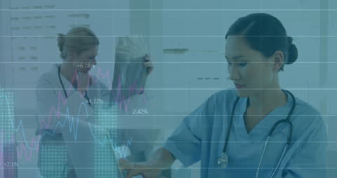 Female Doctors Analyzing Medical Data in Digital Interface