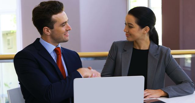 Business Professionals Shaking Hands During Meeting at Office - Download Free Stock Images Pikwizard.com