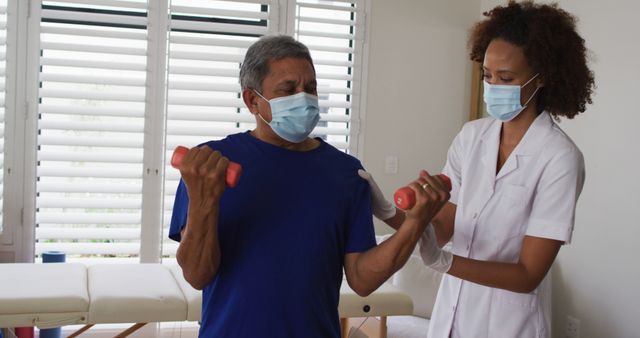 Elderly Man Lifting Dumbbells with Physical Therapist - Download Free Stock Images Pikwizard.com