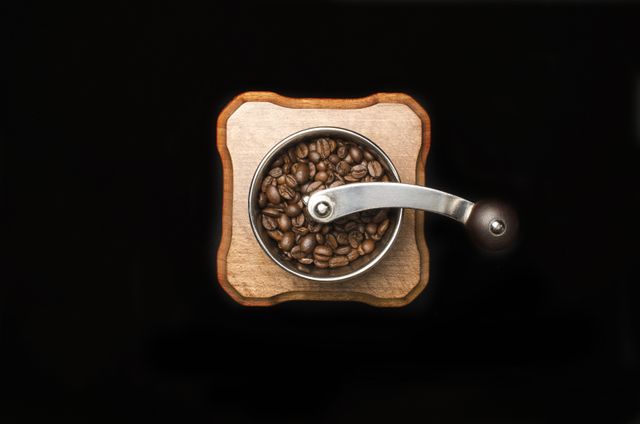 Perfect for websites and blogs about coffee, brewing methods, and kitchen appliances. Use in marketing materials for coffee shops, cafes, or coffee bean sellers. Ideal for social media posts promoting fresh coffee or showcasing stylish kitchen decor.