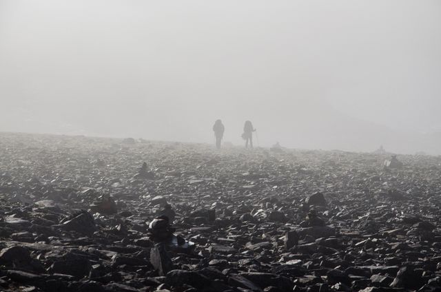 Hikers Walking in Foggy Rocky Landscape - Download Free Stock Images Pikwizard.com