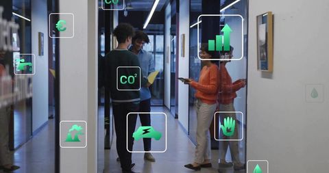 Colleagues Collaborating with Augmented Reality Interfaces in Modern Office