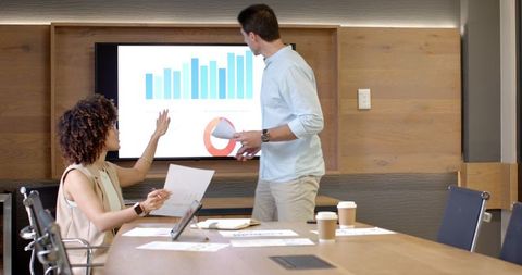 Team Collaboration Analyzing Data in Modern Office Environment