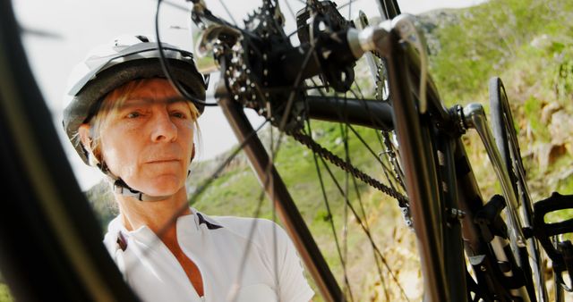 Cyclist Repairing Bicycle on Mountain Trail - Download Free Stock Images Pikwizard.com