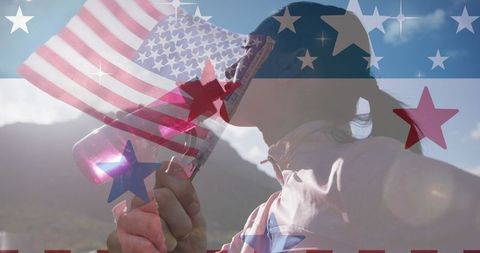 Woman with dual exposures of american flag and mountain scenery