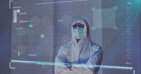 Scientist in protective gear analyzing digital data panels