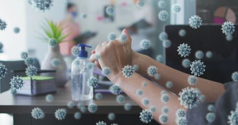 Hand sanitizing in office surrounding by 3d virus concept art