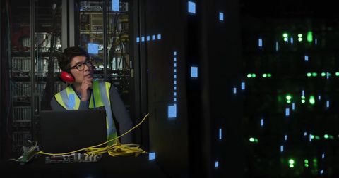 IT Engineer Analyzing Data in Server Room with Digital Interface - Download Free Stock Images Pikwizard.com