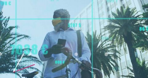 Commuter checking smartphone while holding bicycle and shoulder bag under palm-lined skyline