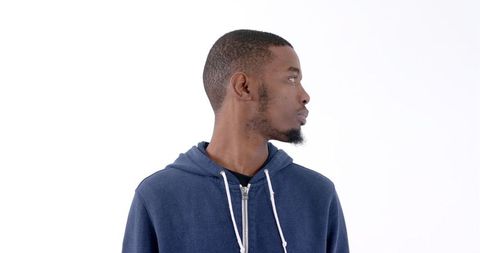 Thoughtful Young Man in Blue Hoodie Standing in Profile - Download Free Stock Images Pikwizard.com