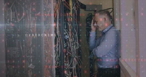 Worried Technician Facing Cybercrime Threat in Server Room - Download Free Stock Images Pikwizard.com