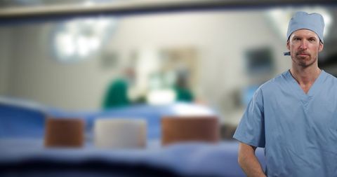 Confident Male Doctor in Hospital Setting with Medical Focus