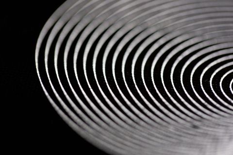 Abstract concentric circles on dark background