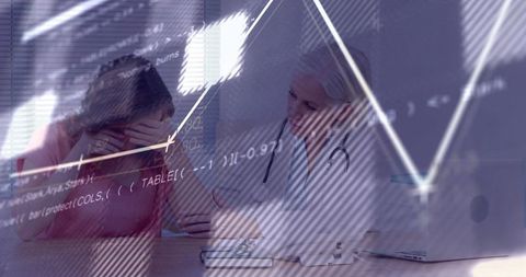 Doctor consoling distressed patient during data-driven consultation with analytics overlay