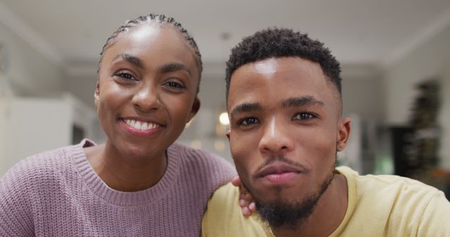 Happy african american couple waving to camera during image call. Lifestyle, relationship, spending free time together concept.