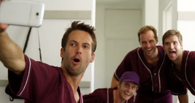 Excited Baseball Team Taking Selfie in Locker Room - Download Free Stock Images Pikwizard.com