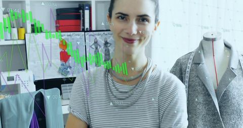 Fashion Designer Analyzing Digital Data in Studio