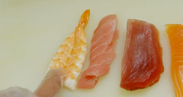 Hand Placing Raw Seafood Slices for Sushi Preparation - Download Free Stock Images Pikwizard.com