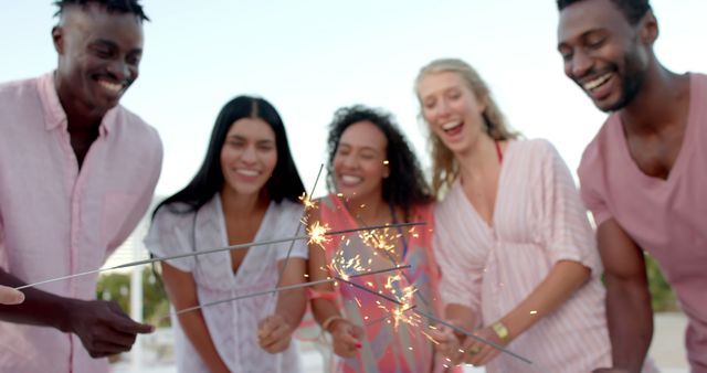 Friends Celebrating with Sparklers Outdoors - Download Free Stock Images Pikwizard.com