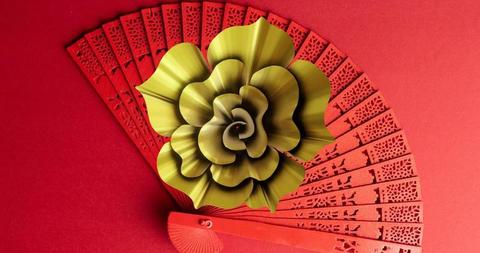 Chinese Inspired Fan with Metallic Flower on Red Background - Download Free Stock Images Pikwizard.com