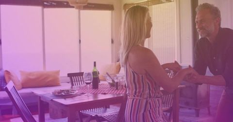 Mature Couple Sharing Moments on Porch with Wine and Candles