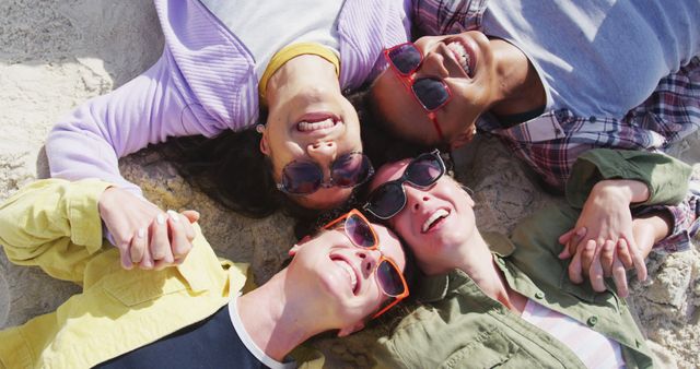 Friends Relaxing and Bonding on a Sandy Beach - Download Free Stock Images Pikwizard.com