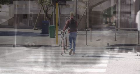 Person Walking Bicycle on City Street Blending Essence of Urban Life - Download Free Stock Images Pikwizard.com