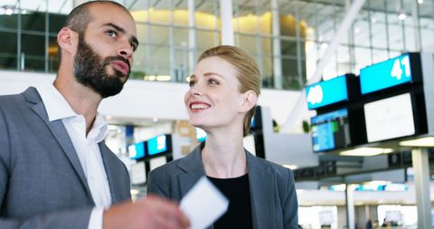 Professionals discussing business at airport lounge