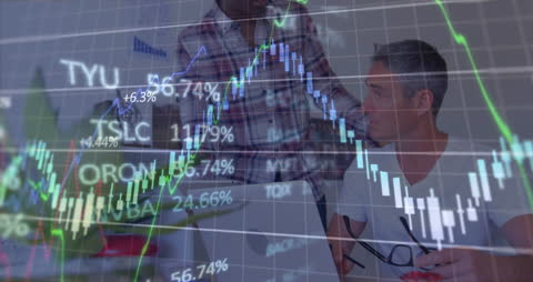 Business Professionals Discussing Market Trends Surrounded by Graphs