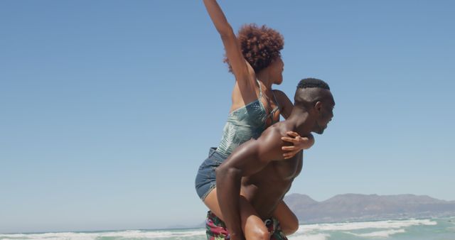 Joyful couple having fun at beach on summer day - Download Free Stock Images Pikwizard.com